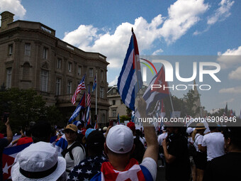 Thousands of demonstrators opposing Cuba's government gather outside of the Cuban Embassy in Washington, D.C. after a march from the White H...