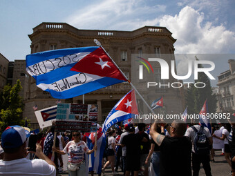 Thousands of demonstrators opposing Cuba's government gather outside of the Cuban Embassy in Washington, D.C. after a march from the White H...