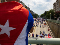 Supporters watch as demonstrators march under an overpass during a demonstration for Cuban rights in Washington, D.C. on July 26, 2021 (