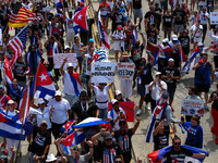 Demonstrators march under an overpass during a demonstration for Cuban rights in Washington, D.C. on July 26, 2021 (