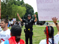 Secret Service officers move back thousands of protestors from Lafayette Park in front of the White House during a demonstration for Cuban r...