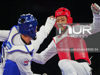 Hongyi Sun from China and Ivan Sapina from Croatia during Taekwondo at the Olympics at Makuhari Messe Hall A, Tokyo, Japan on July 27, 2021....