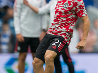   Daniel James of Manchester United warms up during the Pre-season Friendly match between Queens Park Rangers and Manchester United at the K...