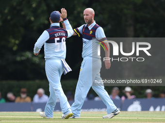 Sean Dickson of Durham (l) congratulates Chris Rushworth of Durham on his wicket during the Royal London One Day Cup match between Middlesex...