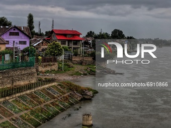 View of residential houses as Water Level increases after Rainfall in Sopore, District Baramulla Jammu And Kashmir, India on 28 July 2021. 4...