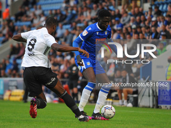 Colchesters Brenden Wiredu holds the ball away from ipswichs Rekeem Harper during the Pre-season Friendly match between Colchester United an...
