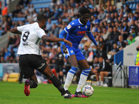 Colchesters Brenden Wiredu holds the ball away from ipswichs Rekeem Harper during the Pre-season Friendly match between Colchester United an...