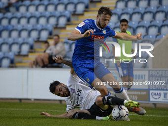 Ipswichs Scott Fraser tackles Colchesters Ryan Clampin during the Pre-season Friendly match between Colchester United and Ipswich Town at th...