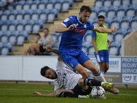 Ipswichs Scott Fraser tackles Colchesters Ryan Clampin during the Pre-season Friendly match between Colchester United and Ipswich Town at th...