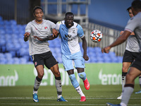   Cheikhou Kouyate passes the ball under pressure from Sean Clare during the Pre-season Friendly match between Crystal Palace and Charlton A...
