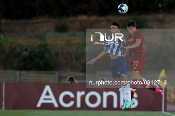 Joao Mario of FC Porto(L) vies with Riccardo Calafiori of AS Roma during an international club friendly football match between AS Roma and F...