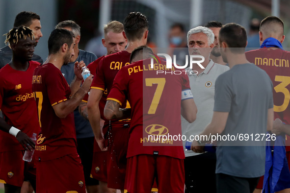 AS Roma's head coach Jose Mourinho (3rd R) speaks with his players during an international club friendly football match between AS Roma and...