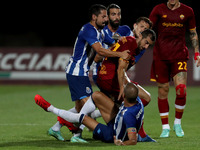 Pepe of FC Porto (center down) argues with Henrikh Mkhitaryan of AS Roma (R ) during an international club friendly football match between A...