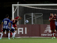 Gianluca Mancini of AS Roma (3rd L) shoots to score during an international club friendly football match between AS Roma and FC Porto at the...