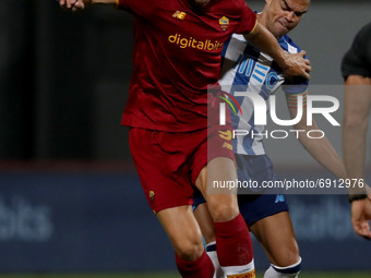 Edin Dzeko of AS Roma (L) vies with Pepe of FC Porto during an international club friendly football match between AS Roma and FC Porto at th...