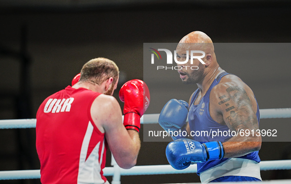 Frazer Clarke from Great Britain and Tsotne Rogava from Ukraine during pre final boxing knock out rounds at Kokugikan arena at the Tokyo Oly...