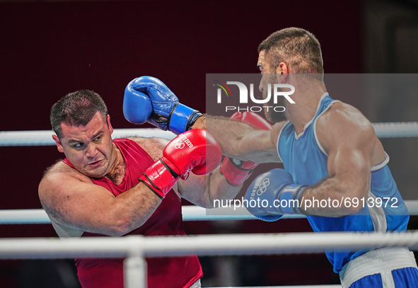 Mourad Aliev from  France and Siyovush Zukhurov from Tajikistan during pre final boxing knock out rounds at Kokugikan arena at the Tokyo Oly...