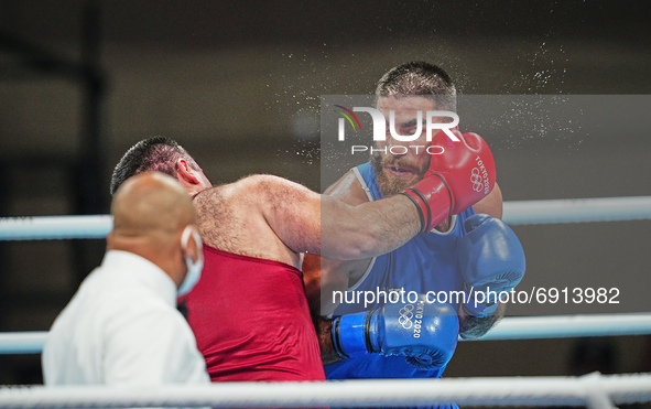 Mourad Aliev from  France and Siyovush Zukhurov from Tajikistan during pre final boxing knock out rounds at Kokugikan arena at the Tokyo Oly...