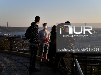 Tourists visit the Nossa Senhora de Monte viewpoint in Lisbon. 28 July 2020. The General Health Authority's Bulletin records 13 deaths and 3...