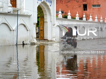 Indian People cross a Flooded street after heavy Monsoon Rains in Pushkar, Rajasthan, India on 31 July 2021.  (