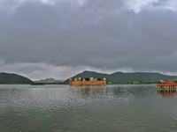 A view of 'Jal Mahal' as clouds hover over the city on a rainy day during the monsoon season in Jaipur, Rajasthan, India, Saturday, July 31,...