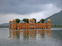 A view of  historical ' Jal Mahal' as clouds hover over it on a rainy day during the monsoon season in Jaipur, Rajasthan, India, Saturday, J...