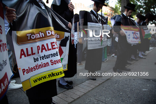 Orthodox jewish people stand demonstrate in support of Palestine in Brooklyn, New York, US, on July 31, 2021.  