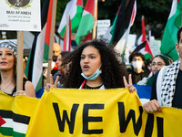 People hold sing during a demonstrate in support of Palestine in Brooklyn, New York, US, on July 31, 2021.  (