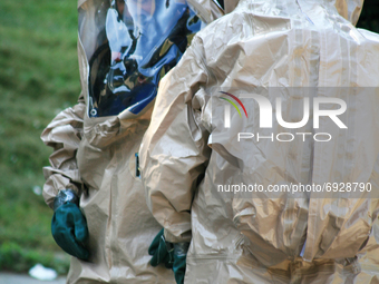 Hazardous materials emergency response workers suit-up while responding to a call to clean up a dangerous chemical spilll in Toronto, Ontari...