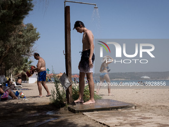 These days Chania reached 40 degrees celsius. Locals and tourists are enjoying the warm weather and take a swim at Kiani Akti beach near Cha...