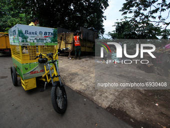 Eco-friendly electric bicycle is seen at a dumping site near settlement in Bogor, West Java, Indonesia, on August 4, 2021.  (
