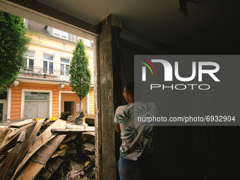 a helpers clean up the a store in Bad Neuenahr-Ahrweiler, Germany on August 4, 2021 as two weeks after flood disaster (