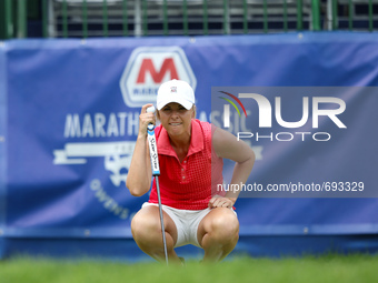 Sara Kemp of Tuncurry, Australia lines up her putt on the 18th inning green during the first round of the Marathon LPGA Classic golf tournam...
