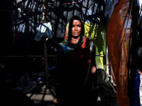 An Indian villager assesses damage in homes following floods  in the Ghatal area of Paschim Medinipur district,West Bengal,India ,about 112...