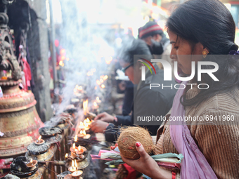 Hindu devotes light votive lamps and incense to offer prayers at the Dakshinkali Temple in Nepal, on December 13, 2011. Dakshinkali Temple i...