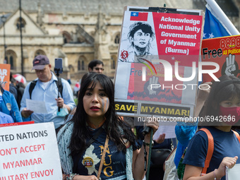 LONDON, UNITED KINGDOM - AUGUST 08, 2021: Members of British Myanmar community and their supporters demonstrate in Parliament Square on the...