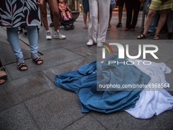 Burkas are seen on the ground.Around a hundred women have participated in a feminist demonstration in front of the United Nations headquart...