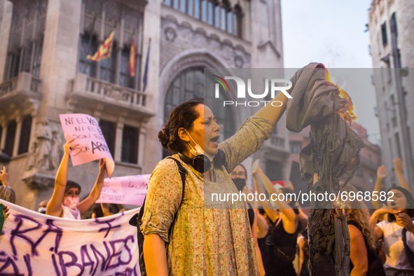 Protester is seen burning a burqa.Around a hundred women have participated in a feminist demonstration in front of the United Nations headq...