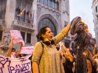 Protester is seen burning a burqa.
Around a hundred women have participated in a feminist demonstration in front of the United Nations headq...