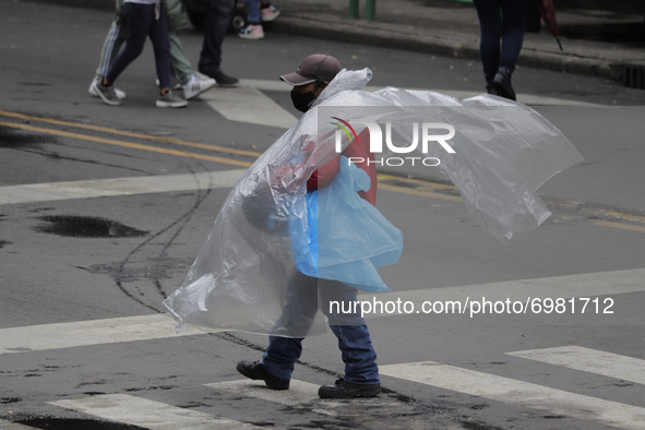 A seller of plastic sheeting in the Historic Centre of Mexico City offers his products after rains and strong gusts of wind due to Hurricane...