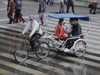 Tourist transport on Eje Central in Mexico City while rains and strong gusts of wind are recorded due to Hurricane Grace that advances throu...