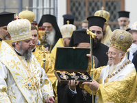 The head of the Orthodox Church of Ukraine, Epiphanius, awarded Ecumenical Patriarch Bartholomew the Order of Archangel Michael during a rel...