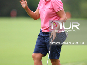 Angela Stanford of Texas greets the gallery after making her putt on the 17th green during the third round of the Marathon LPGA Classic golf...