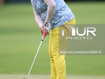 Shanshan Feng of Guangzhou, China follows her putt on the 17th green during the third round of the Marathon LPGA Classic golf tournament at...