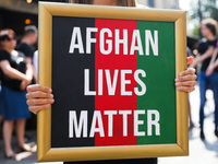 A banner 'Afghan Lives Matter ' is seen during a protest In Solidarity With Afghanistan in front of the U.S. Consulate General in Krakow, Po...