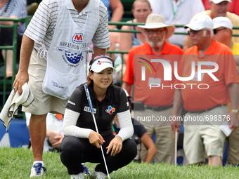 Kyu-Jung Baek of Gumi, South Korea lines up her shot on the 18th green in the final round of the Marathon LPGA Classic golf tournament at Hi...