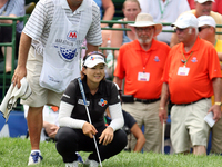Kyu-Jung Baek of Gumi, South Korea lines up her shot on the 18th green in the final round of the Marathon LPGA Classic golf tournament at Hi...
