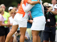 Inbee Park of Seoul, South Korea hugs Lydia Ko of Auckaland, New Zealand after completing the 18th hole in the final round of the Marathon L...