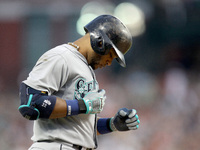 Seattle Mariners' Robinson Cano rounds the bases after his solo home run in the fifth inning of a baseball game against the Detroit Tigers i...