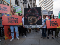 LONDON, UNITED KINGDOM - AUGUST 25, 2021: Activists and campaigners protest near Brazilian Embassy in solidarity with the Indigenous peoples...